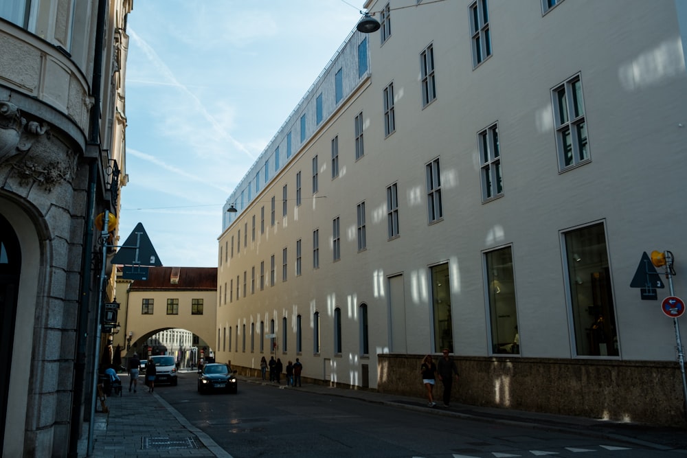 a city street with cars parked on the side of it