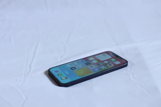 A smartphone showcasing a smooth, elegant mobile app interface in black and blue.