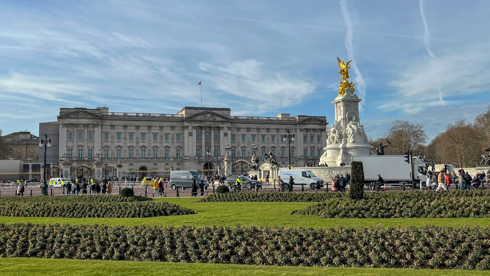 a group of people standing in front of a large building