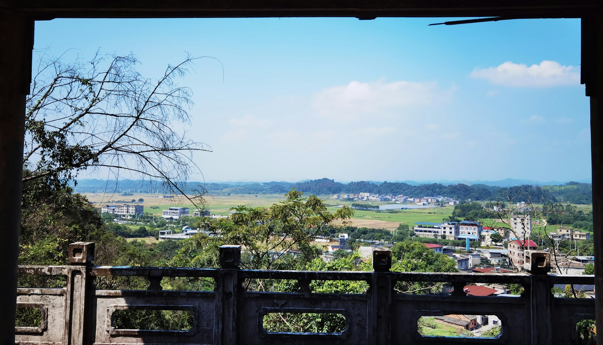 woman wearing yellow long-sleeved dress under white clouds and blue sky during daytime