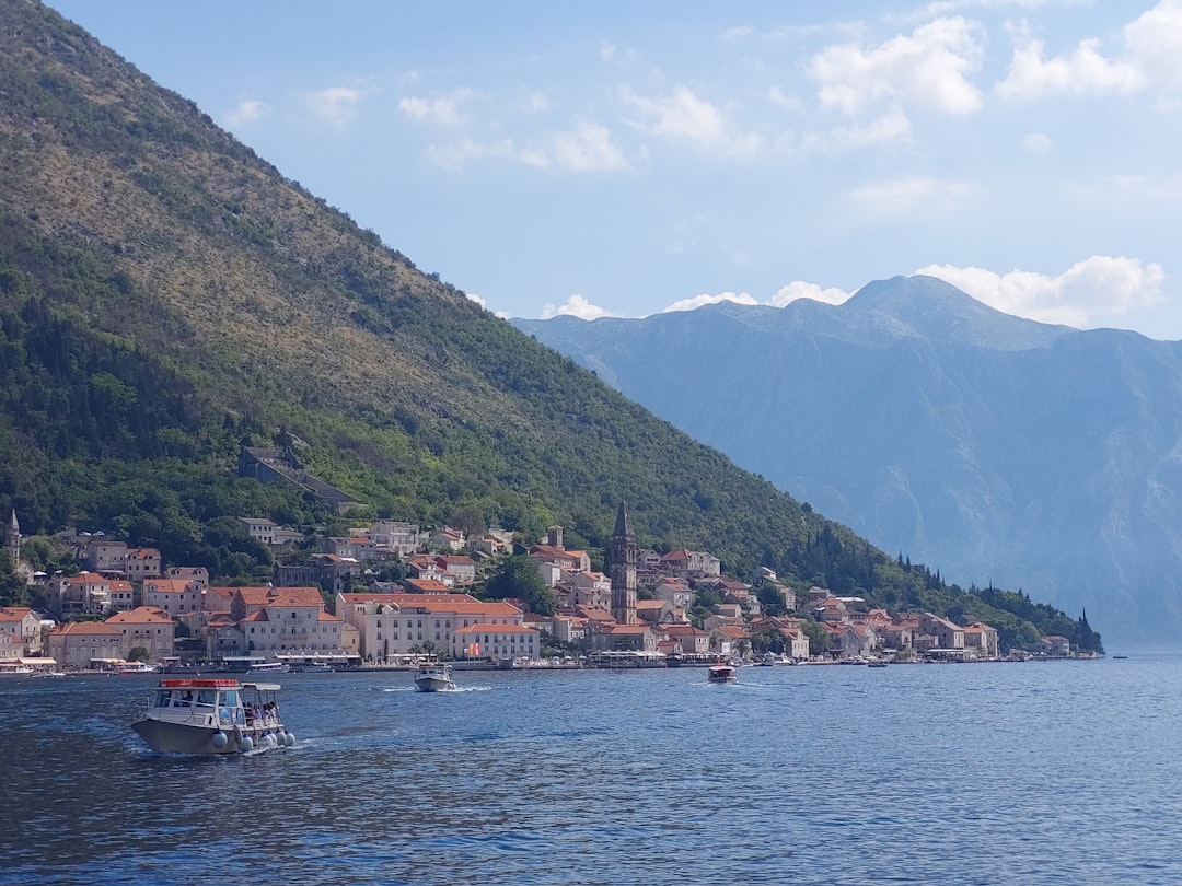 a large body of water surrounded by mountains,