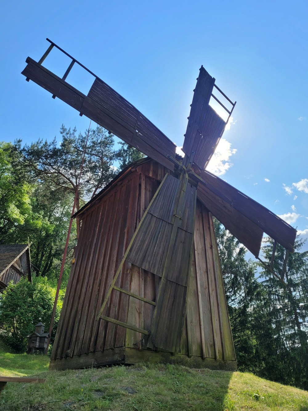 a wooden structure with a cross on top of it