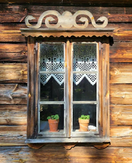 Rustic wooden window installed in a cozy countryside home