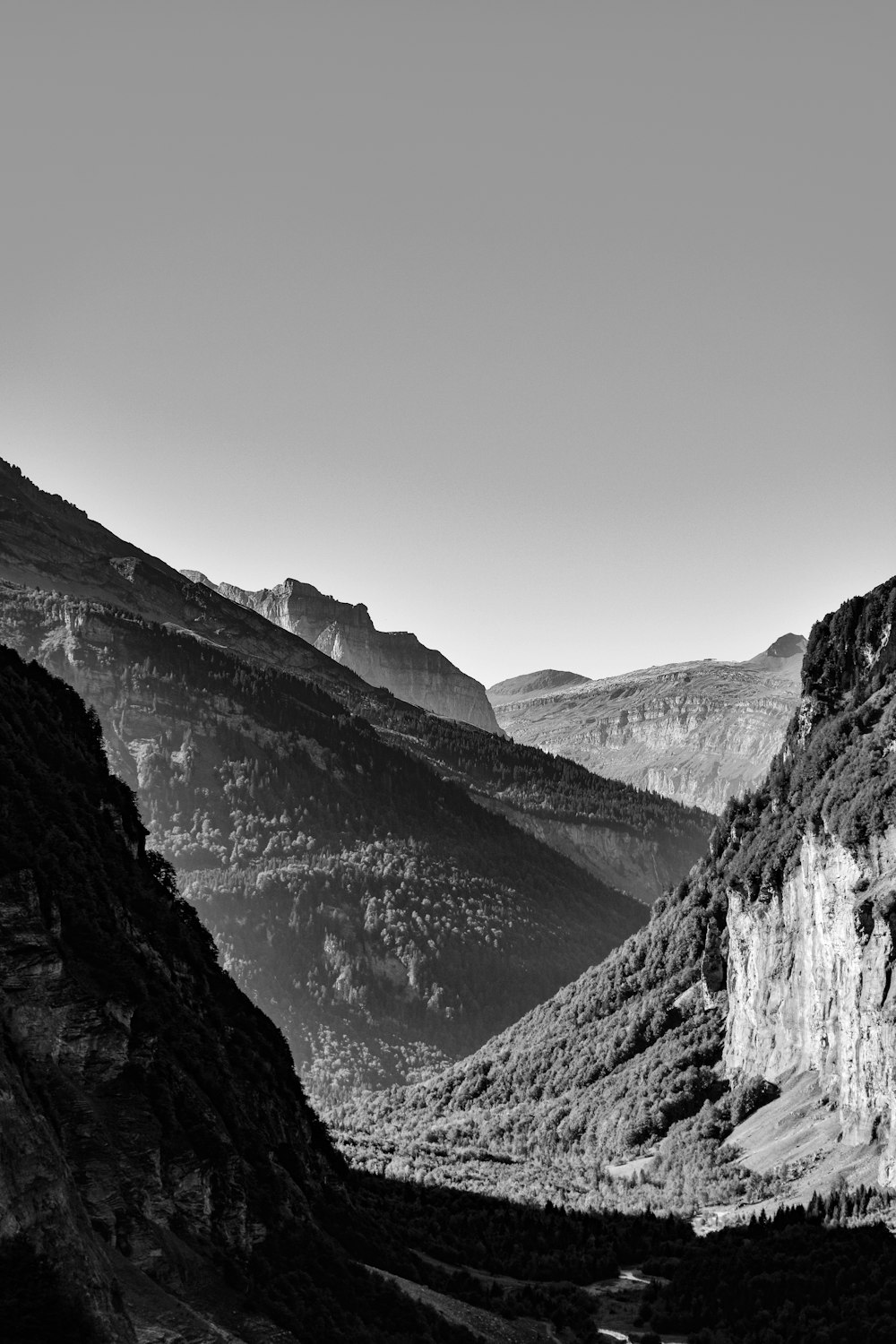 a black and white photo of a mountain range