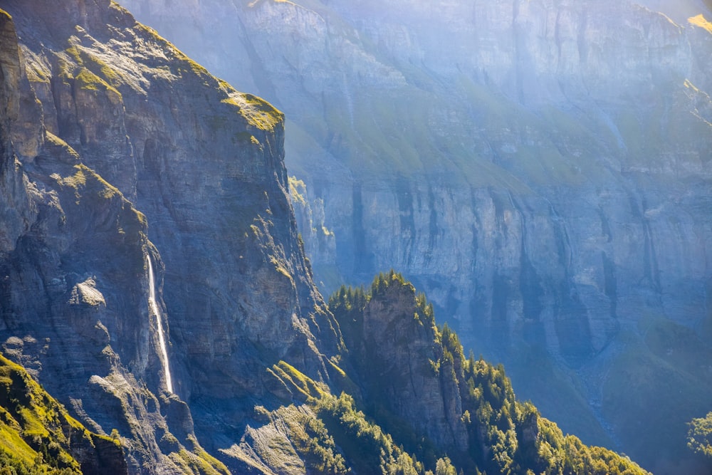 a mountain with a waterfall in the middle of it