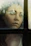 A thoughtful woman reflecting by a window, symbolizing personal growth.