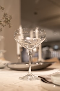 An elegant glass filled with a refreshing cocktail on a table.