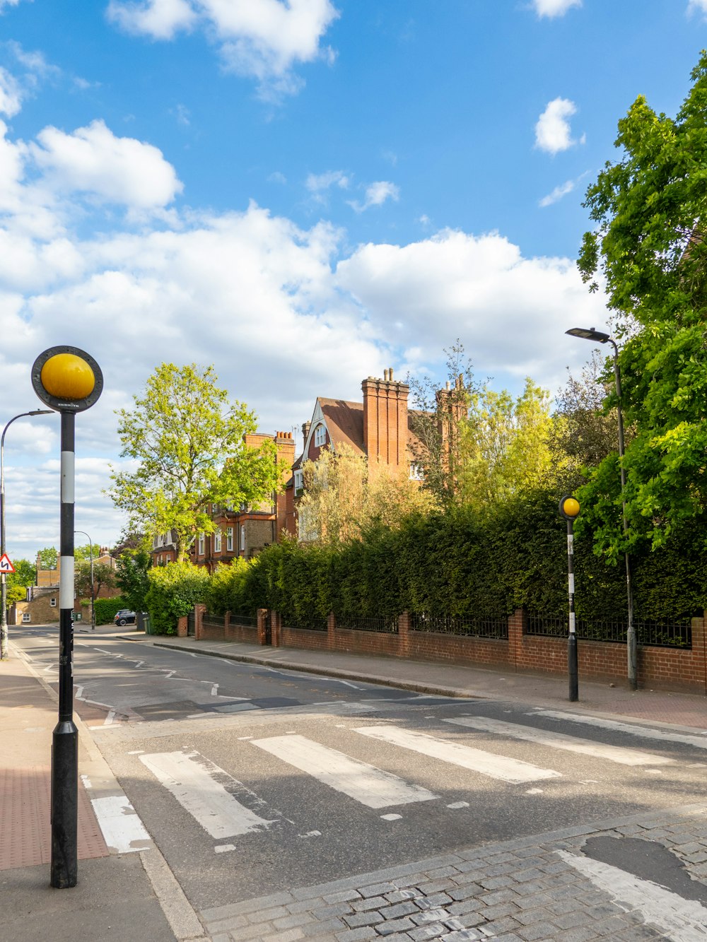 a city street with a yellow traffic light