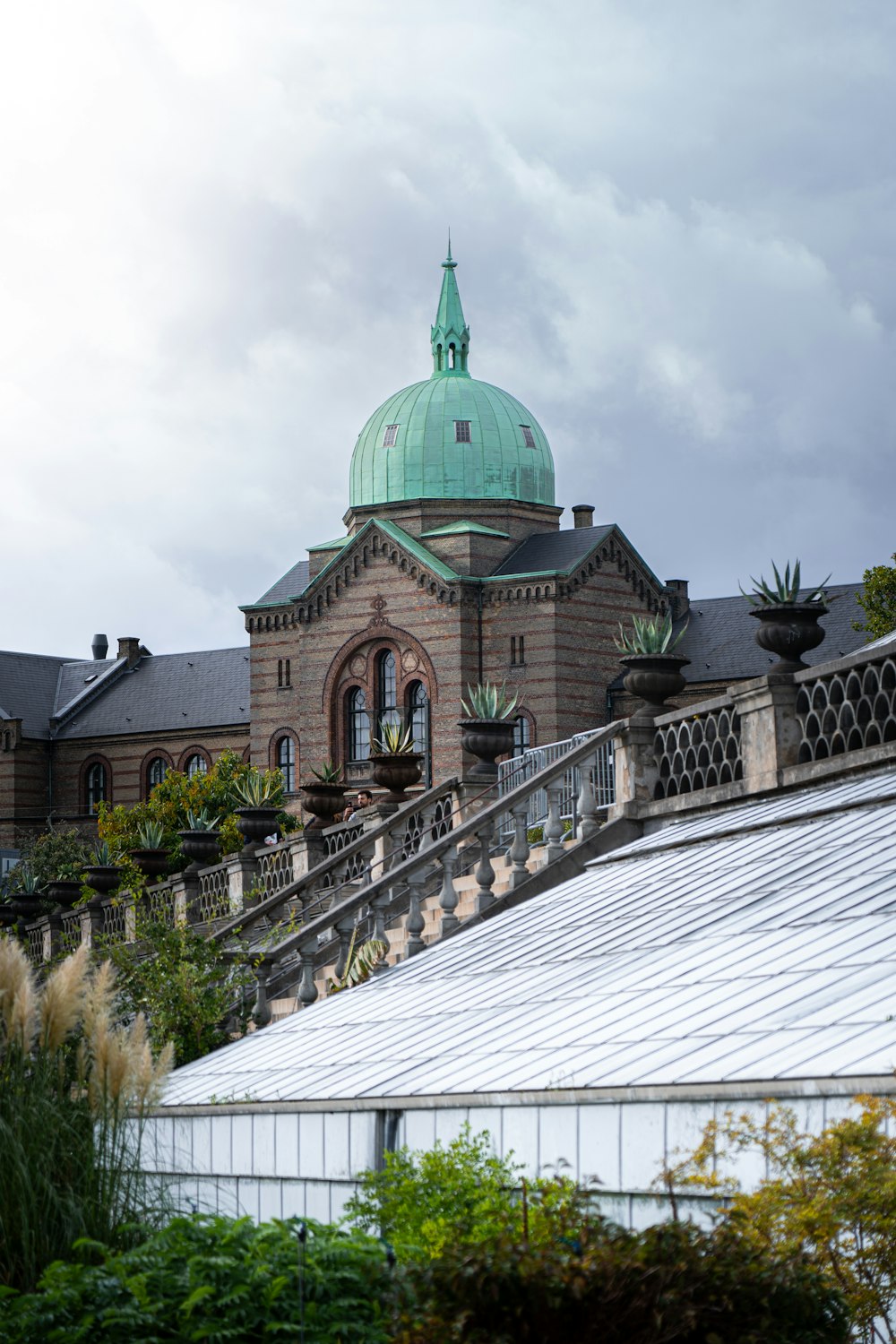 a large building with a green dome on top of it