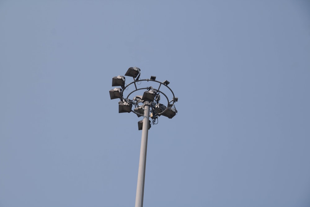 a street light with four lights on top of it