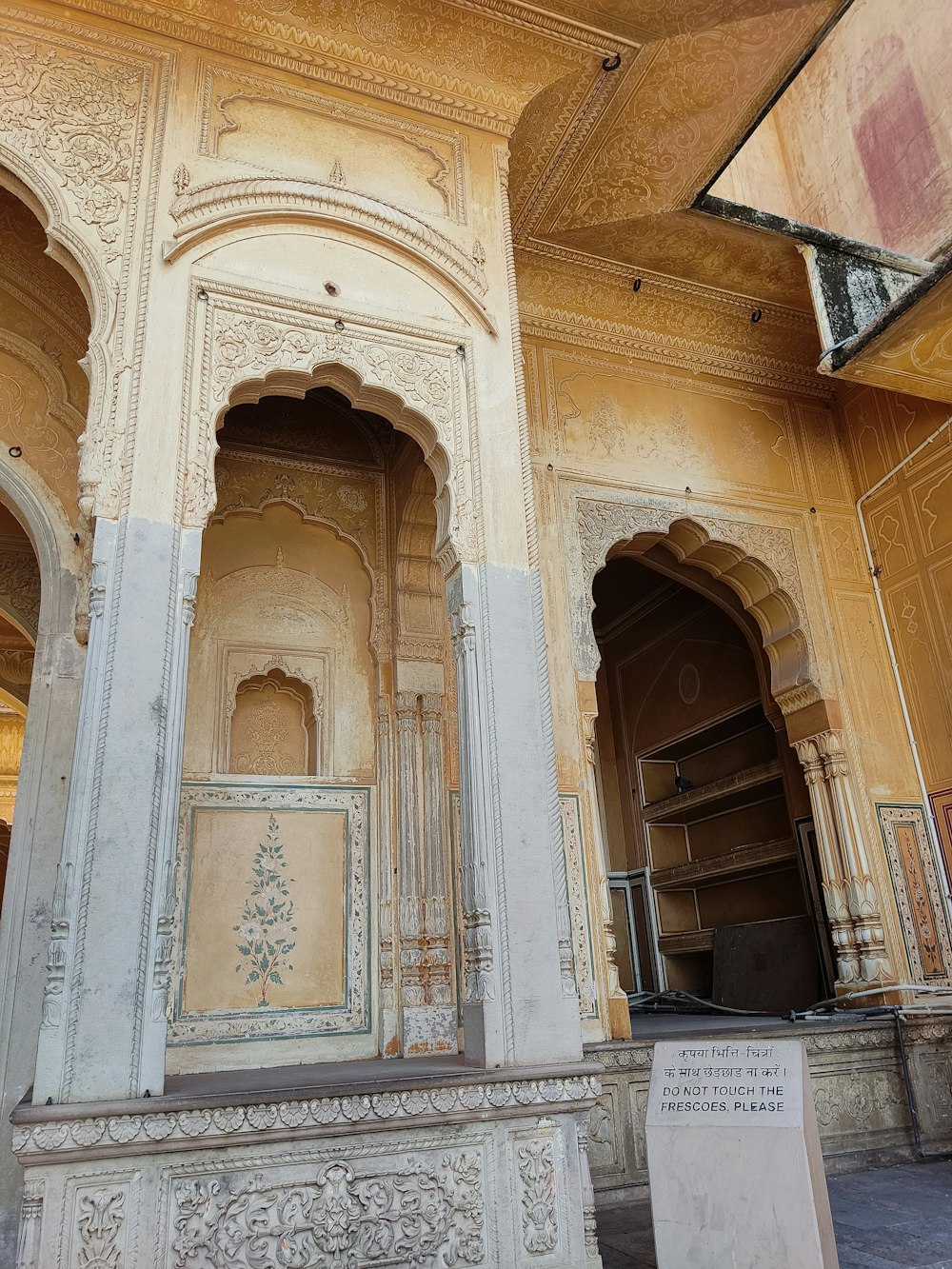 a large white building with arches and pillars