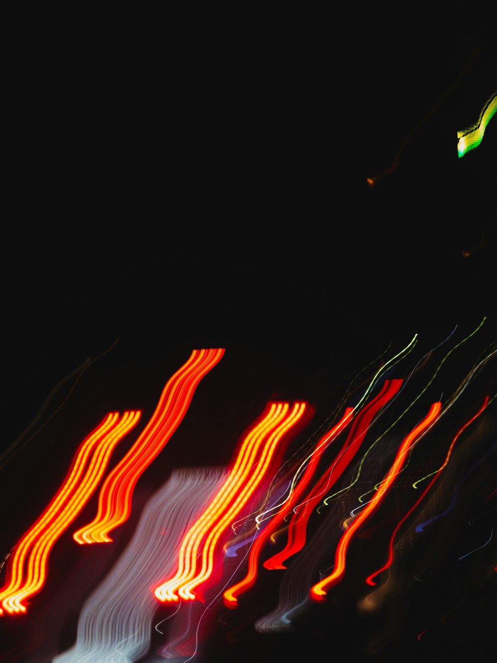 a blurry photo of a street light at night