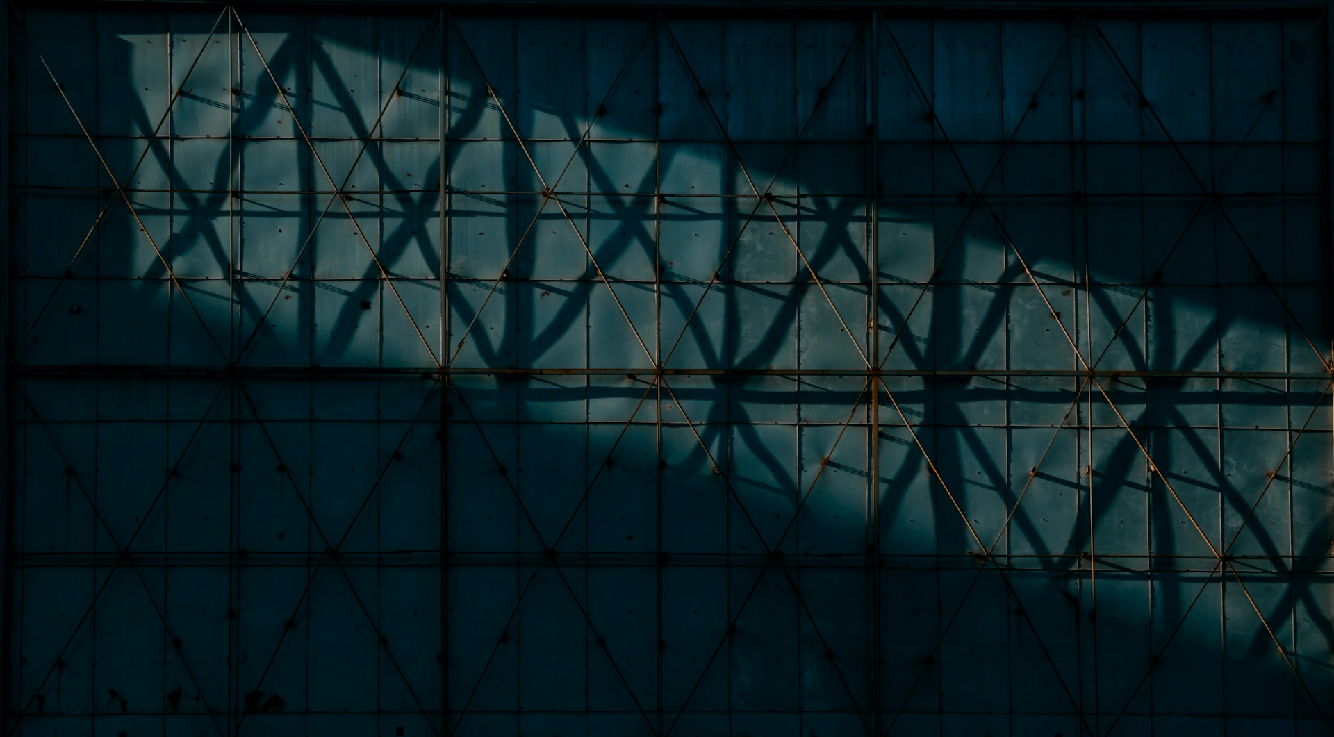 the shadow of a building on a wall