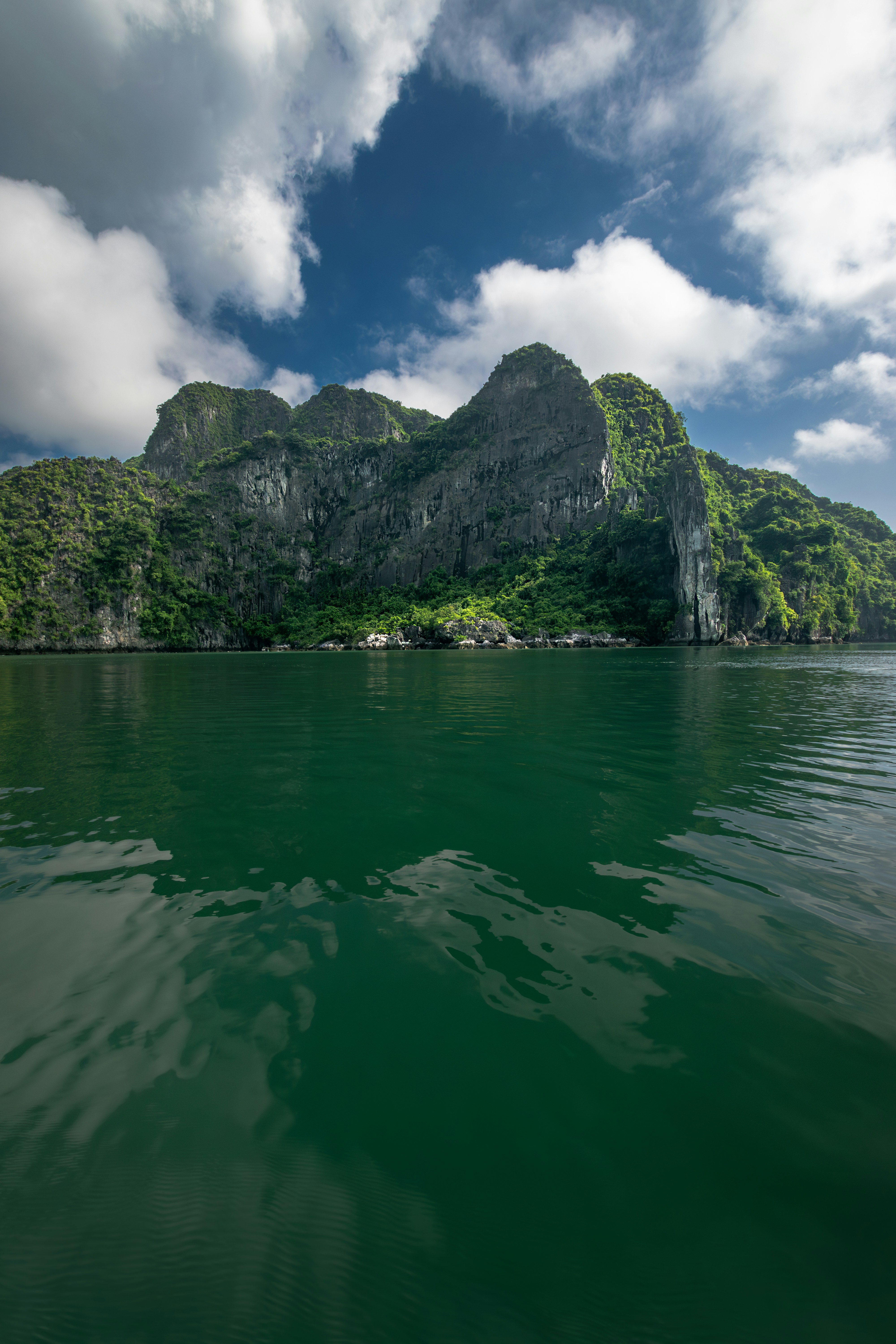 a body of water with a mountain in the background