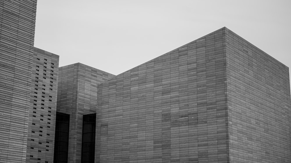 a black and white photo of two tall buildings