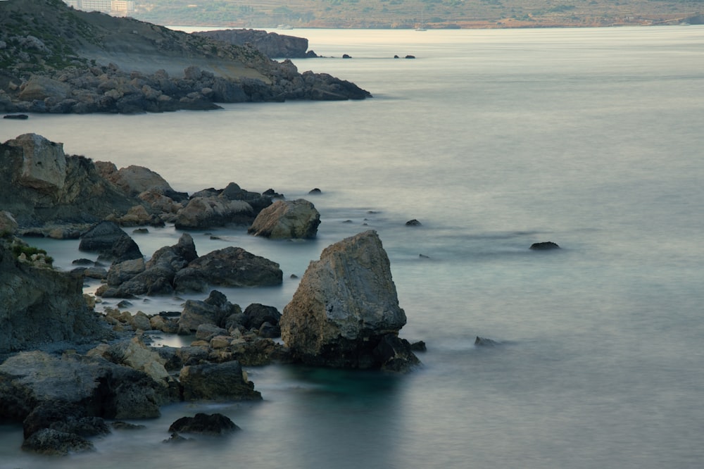 a large body of water surrounded by rocks