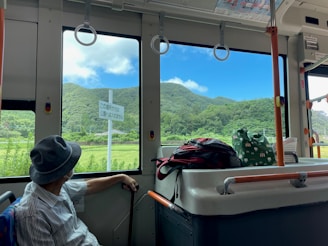 A scenic view from a bus window during a journey.