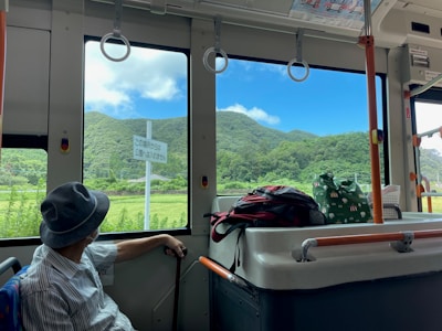A scenic view from a bus window during a journey.