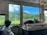 A happy customer enjoying a scenic view during their transfer.