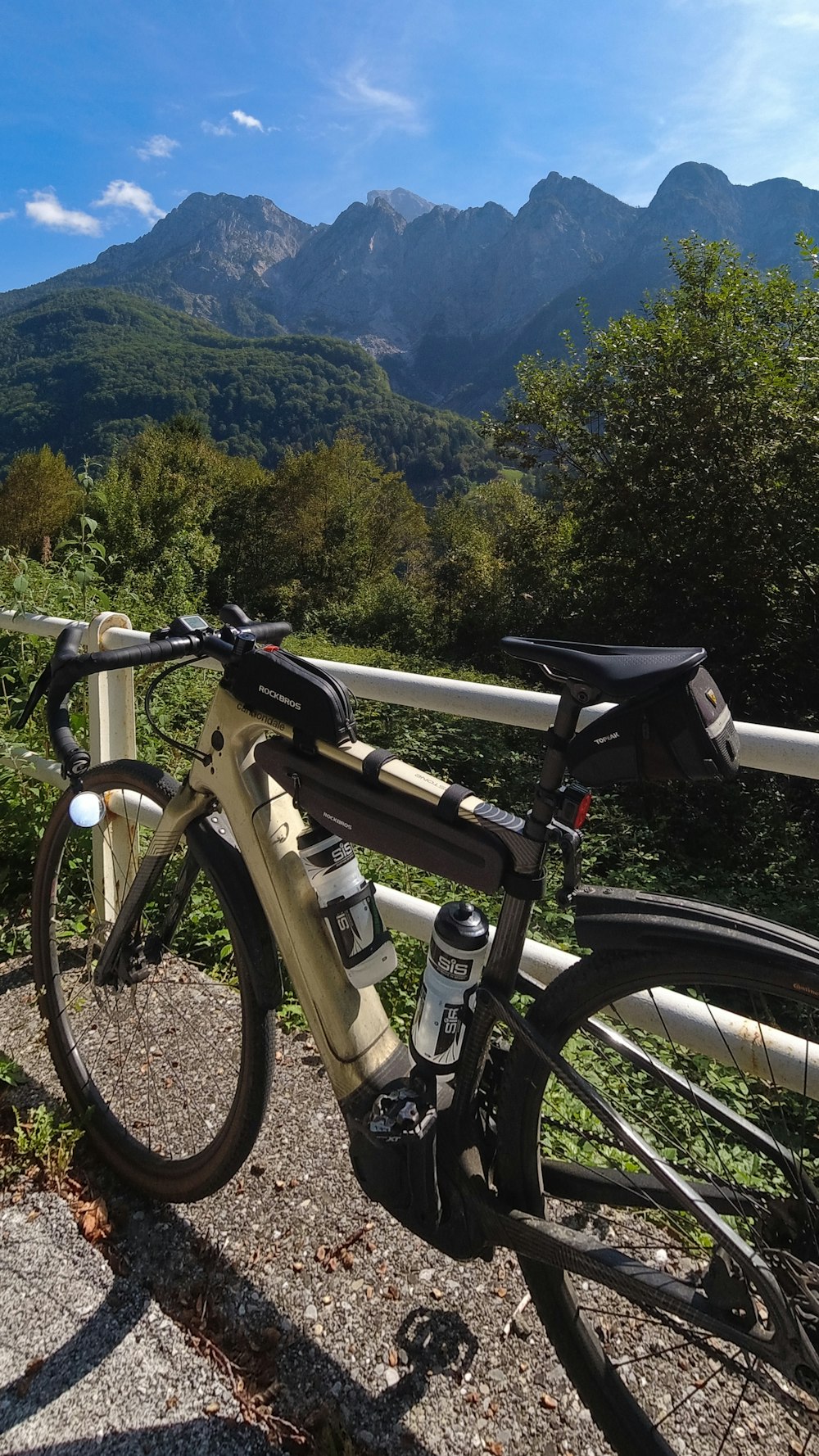 a bicycle parked on the side of a road