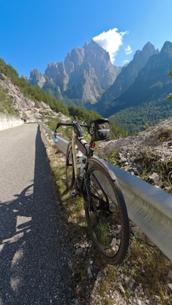 A scenic view of a bicycle parked near a picturesque road in Tirur.