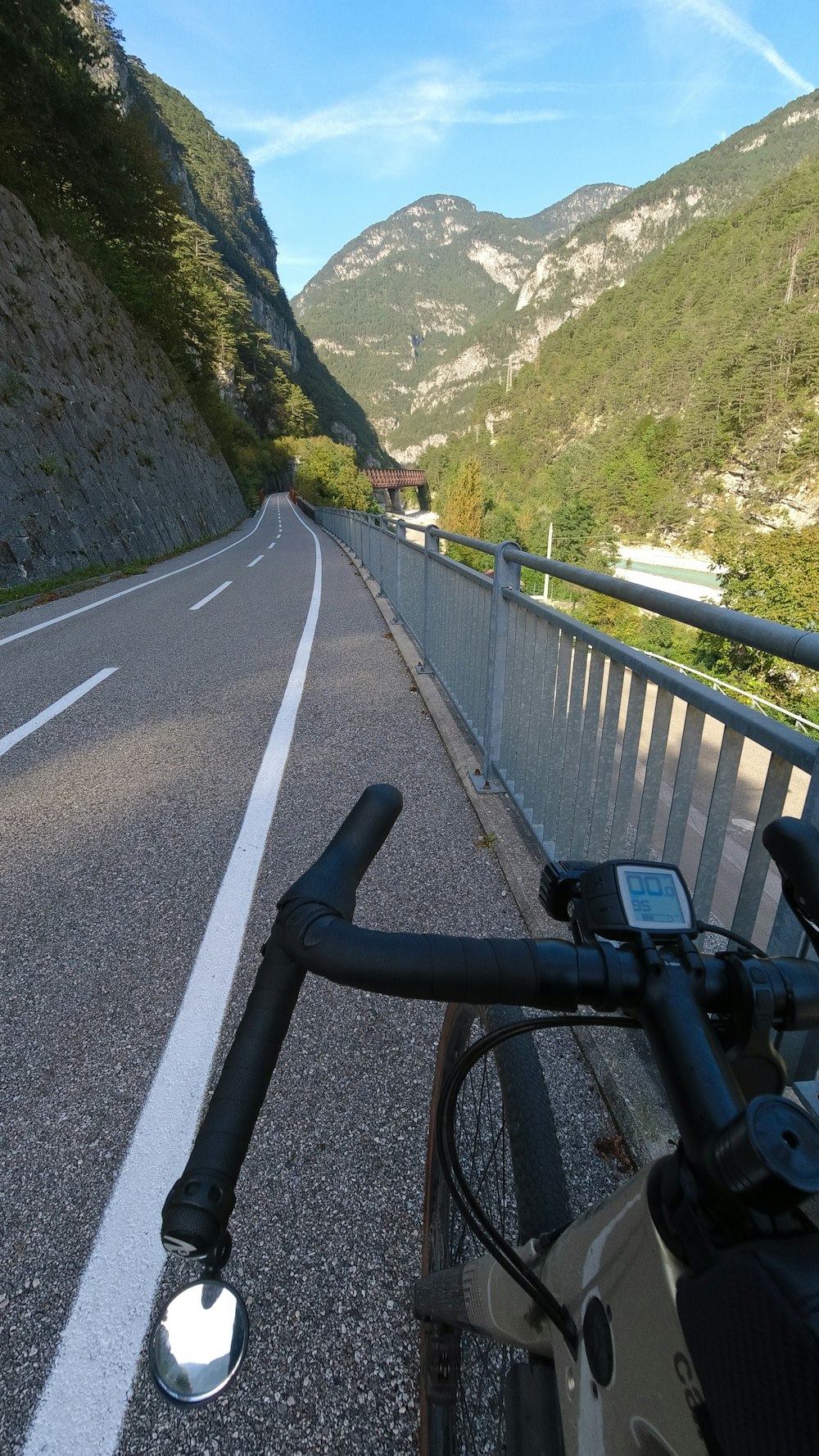 a bicycle is parked on the side of the road