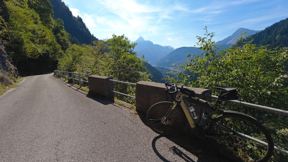 a bicycle parked on the side of a road