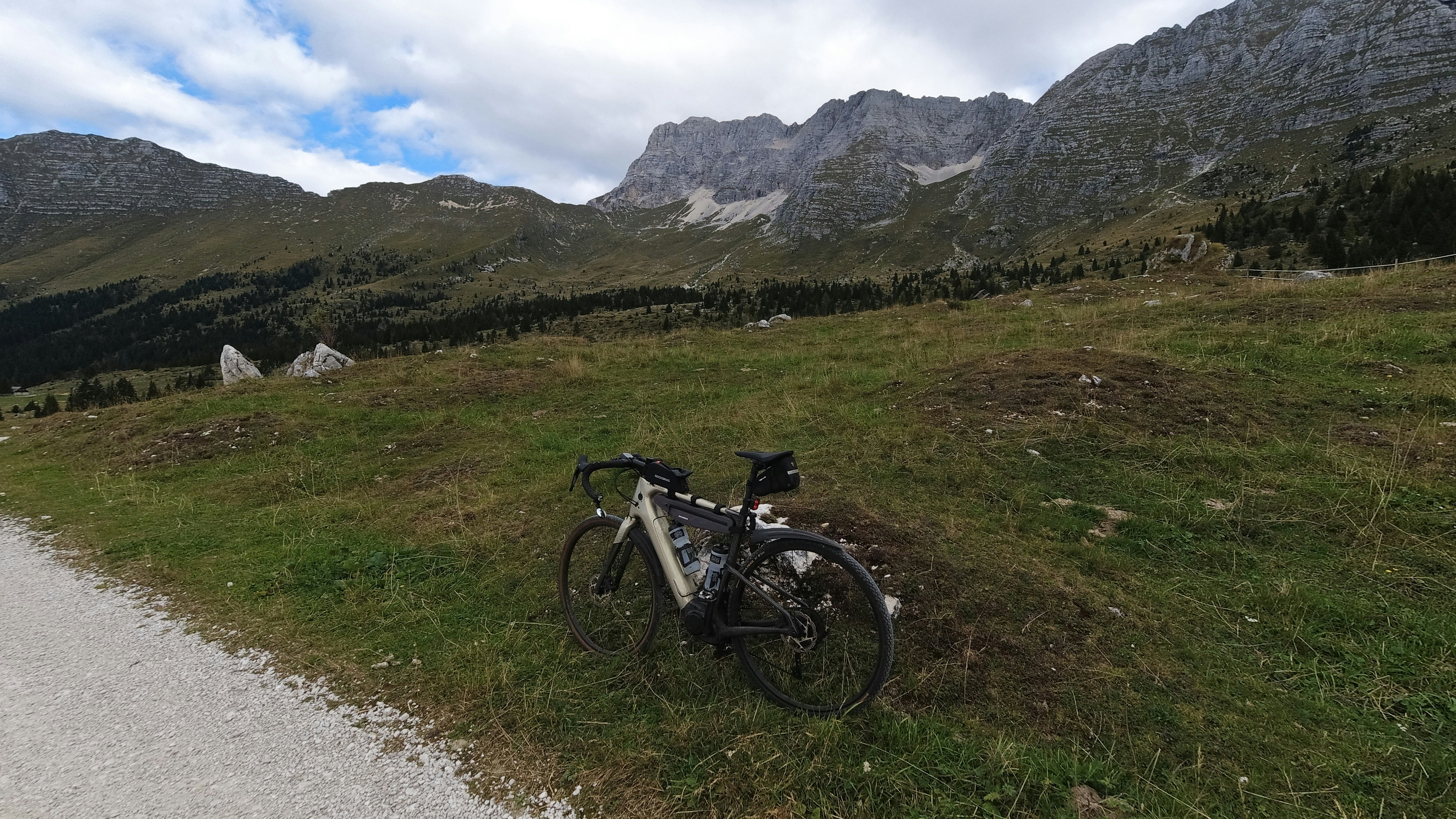 a bicycle parked on the side of a road