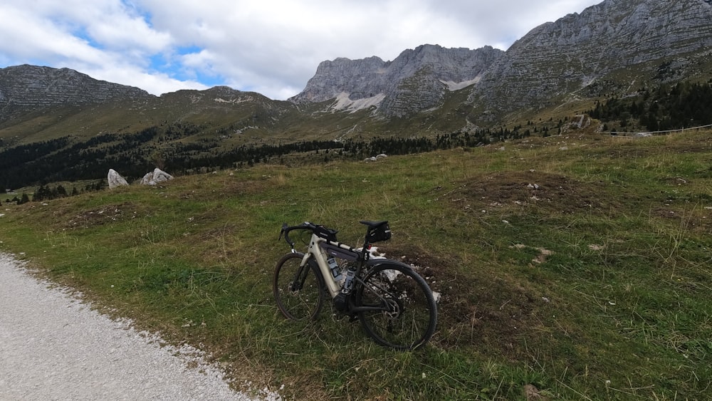 a bicycle parked on the side of a road