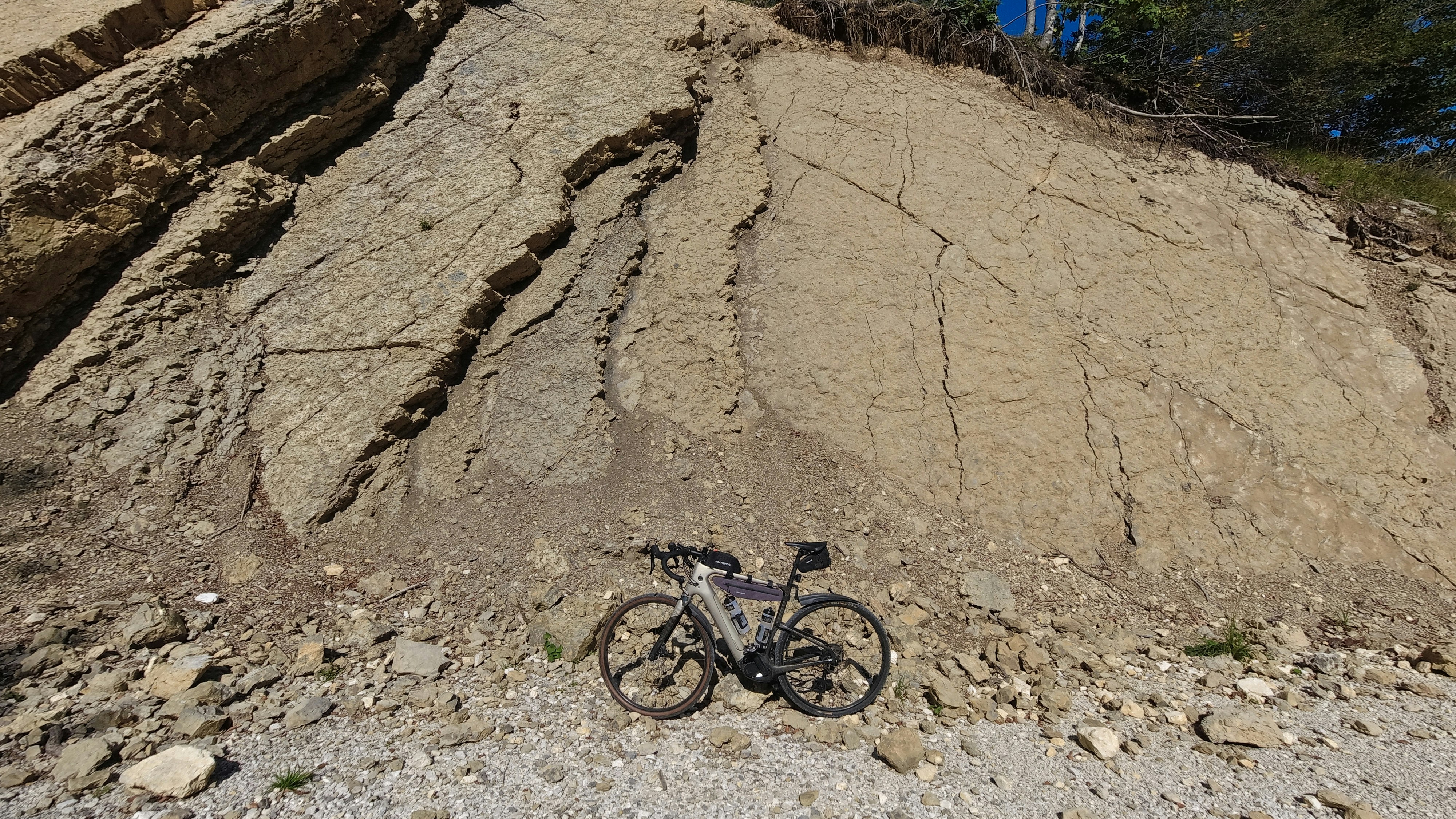 a bike is parked on the side of a mountain