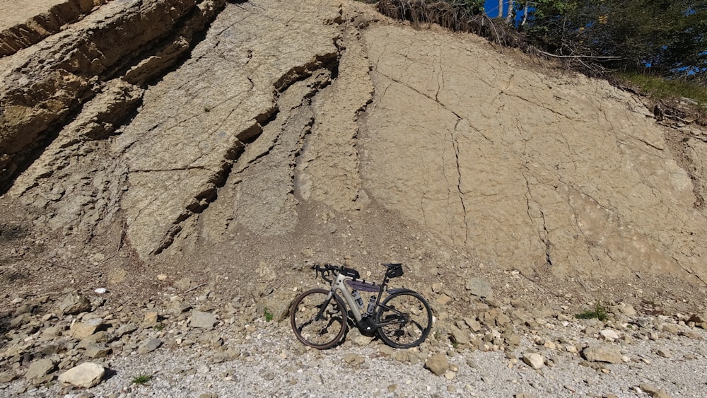 a bike is parked on the side of a mountain