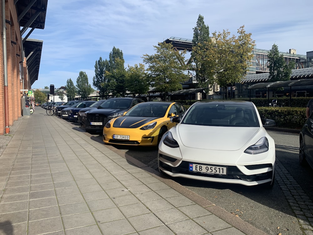 a row of cars parked on the side of a road