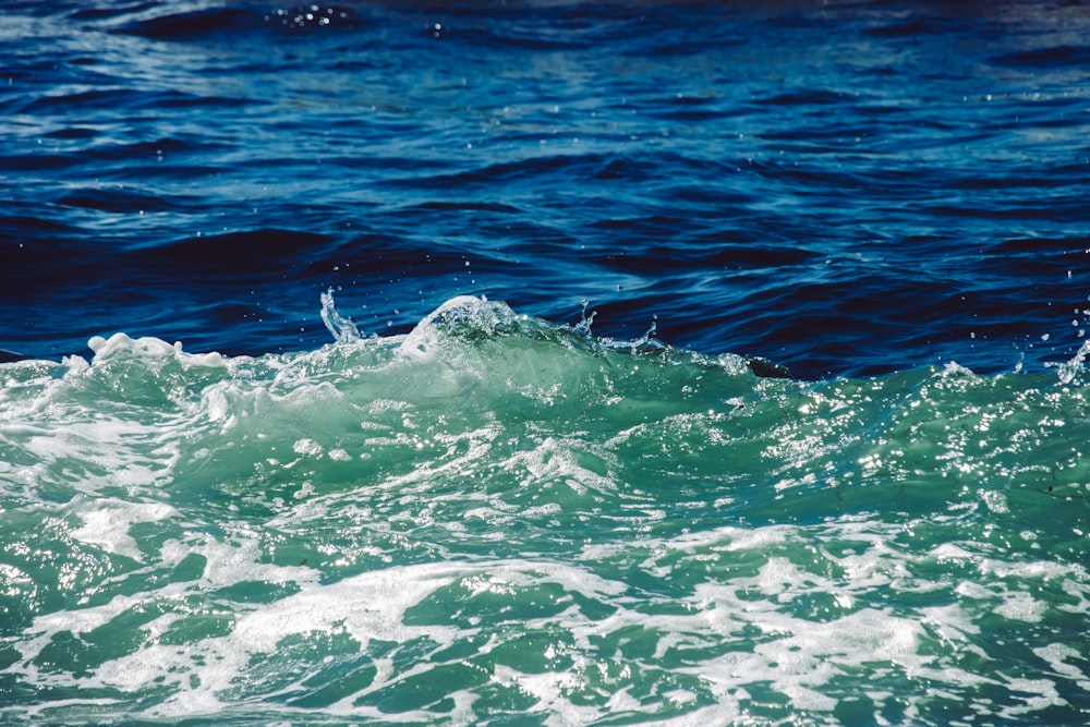 a person riding a surfboard on a wave in the ocean