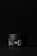 A black cylindrical container with minimalistic white text, labeled with 'SILO'. The container has a matte finish and is set against a dark background, creating a sleek and modern appearance.