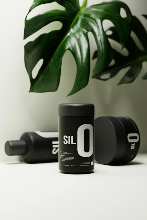 A trendy eco-friendly product setup with green plants and minimalist decor