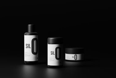 three bottles of silo on a black background