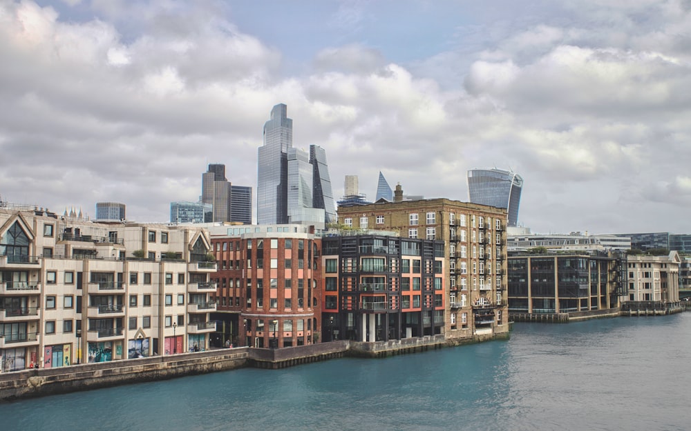 a view of a body of water with buildings in the background