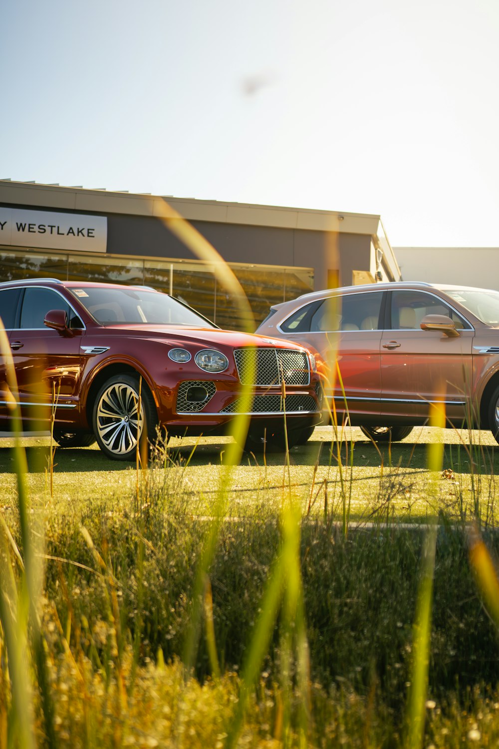 a couple of cars parked in front of a building