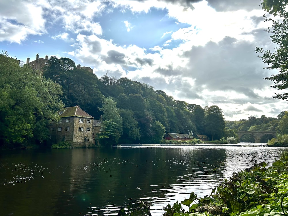 a lake with a house in the middle of it