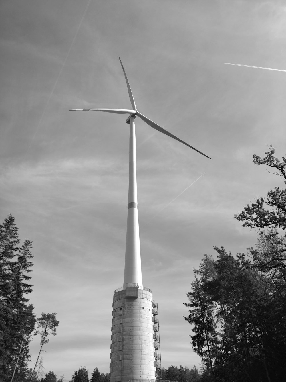 a black and white photo of a wind turbine