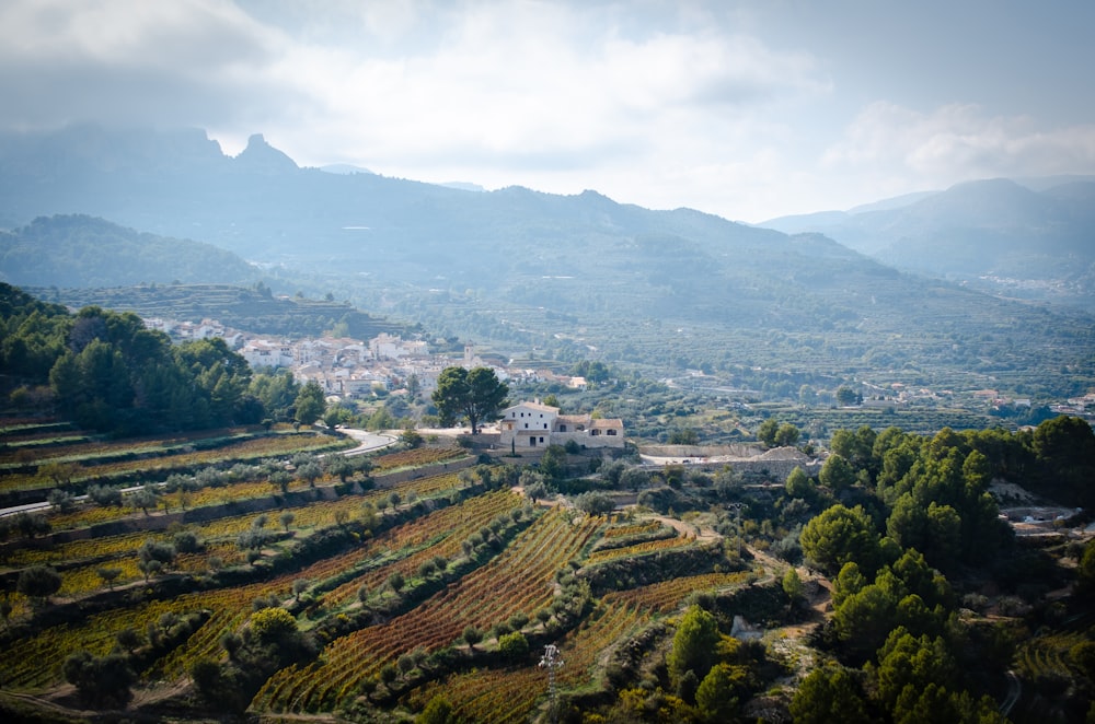 a scenic view of a small village in the mountains