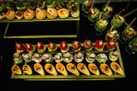 Close-up of colorful canapés artfully presented on a sleek platter.