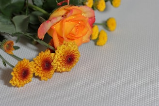 a bunch of flowers that are sitting on a table
