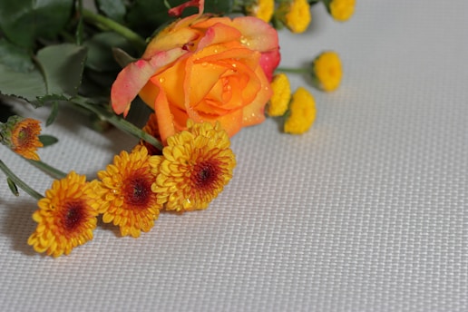 a bunch of flowers that are sitting on a table