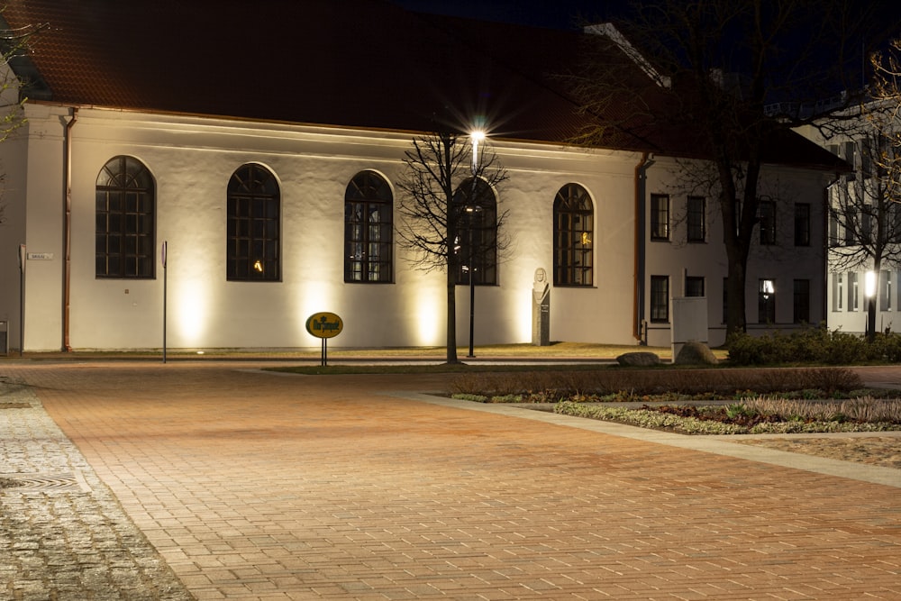 a large white building lit up at night