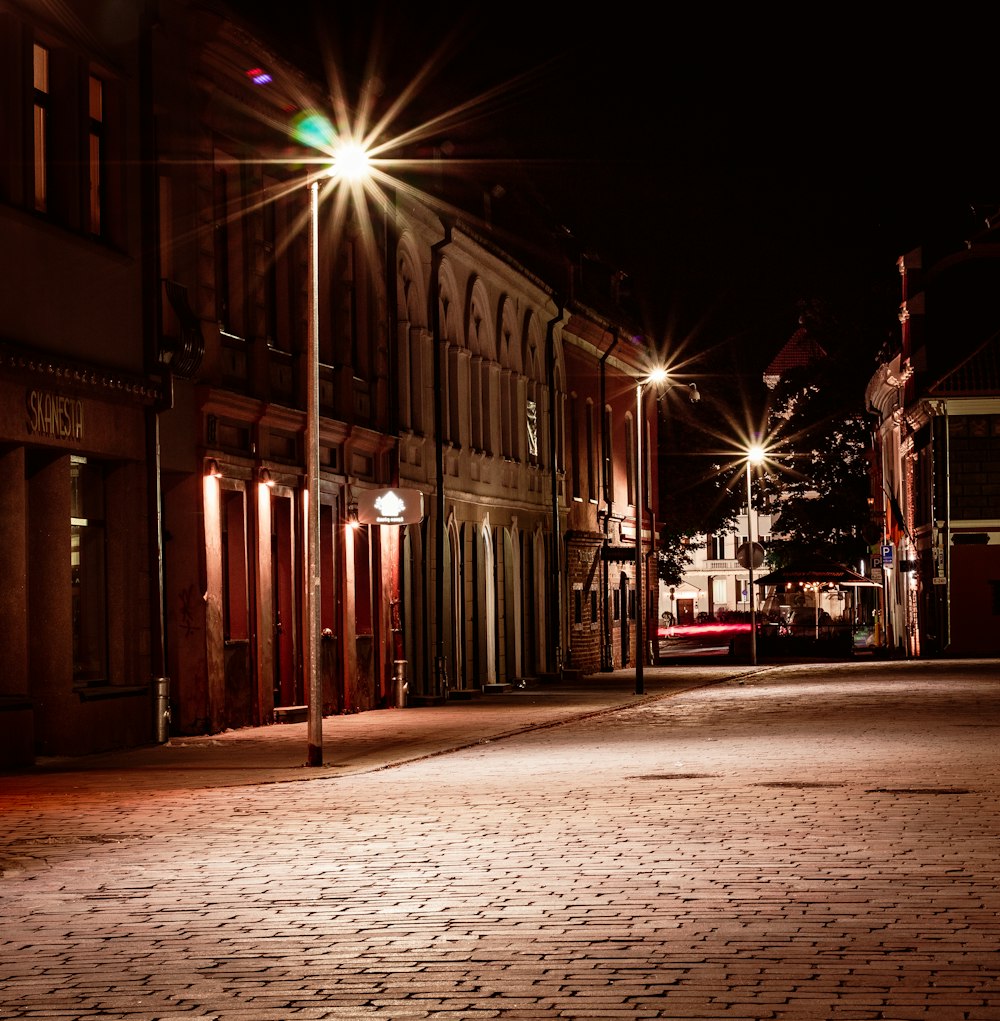 a city street at night with street lights