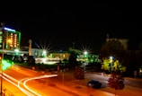 a city street at night with a lot of lights