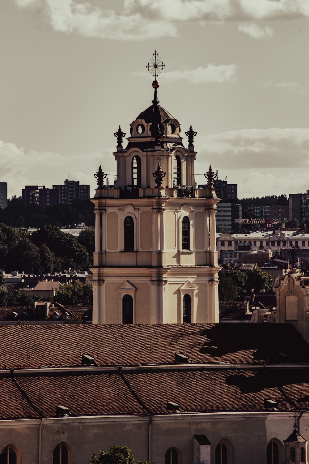 a church tower with a cross on top of it