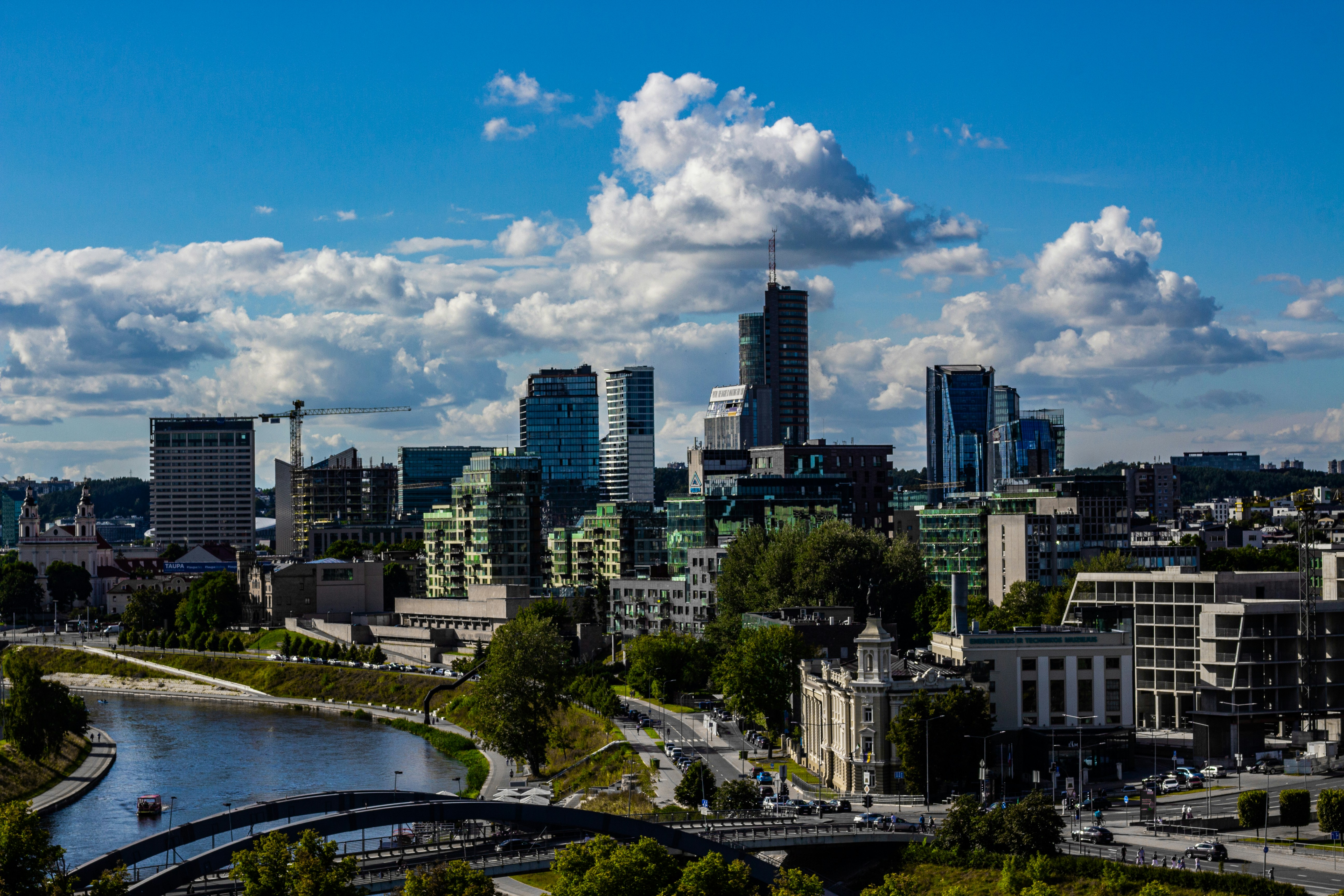 a view of a city with a river running through it, 