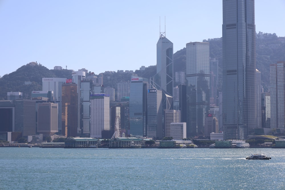 a large body of water with a city in the background